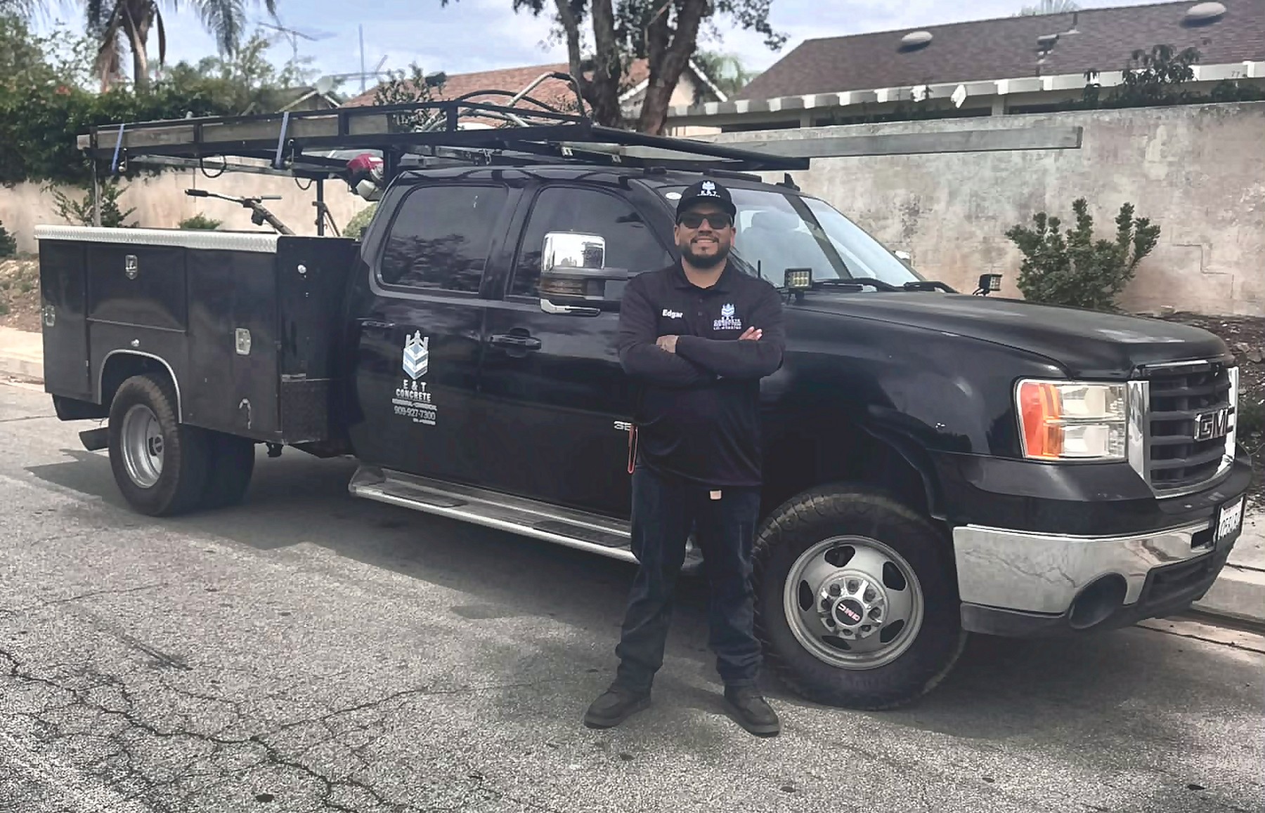 Edgar, founder of E & T Concrete, standing beside the company service truck in Fontana, California